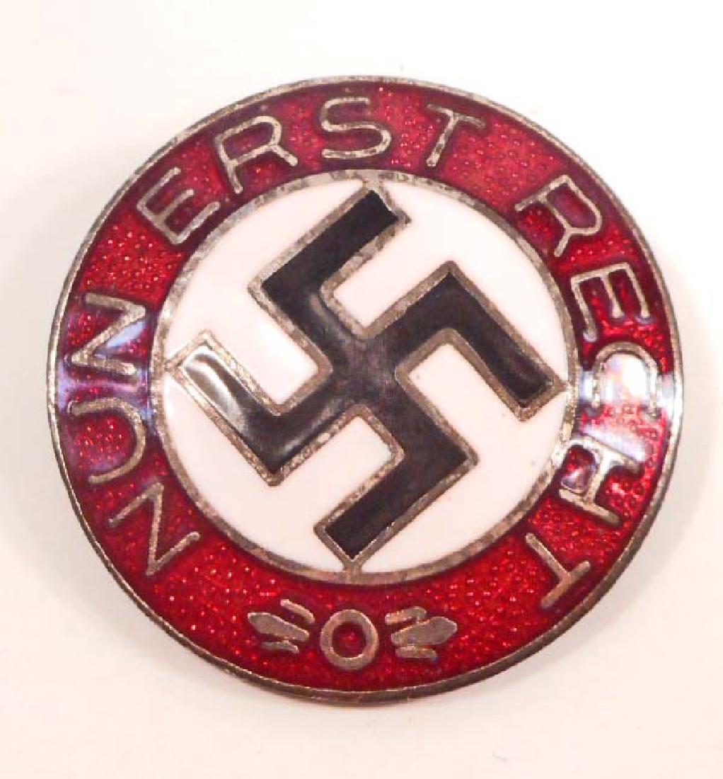 GERMAN NAZI NUN ERST RECHT ENAMELED PARTY BADGE: Measures 1 7/8" in diameter. The reverse side is maker marked 'RZM M1/4 ges gesch'. Has a thin horizontal pin back. Nickel construction with enamel.