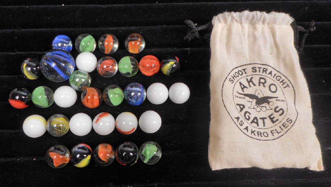 LOT OF AKRO AGATE MARBLES IN CLOTH BAG: Includes 1 shooter marble