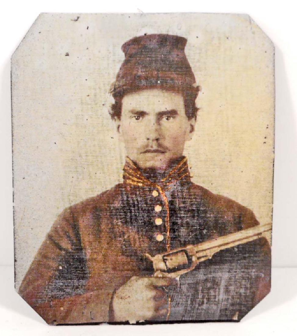 US CIVIL WAR UNION SOLDIER TIN TYPE PHOTO: Measures 2 3/8" wide by 2 15/16" tall. The image shows an enlisted mans soldier wearing a kepi dressed in his uniform. He is holding an Army 1860 Colt pistol. Scarce.
