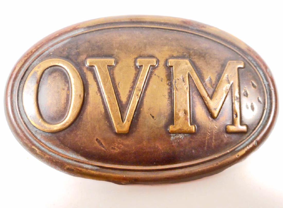 US CIVIL WAR UNION OVM ENLISTED MANS CARTOUCHE BOX: Ohio Volunteer Militia OVM. Measures 3 7/16" wide by 2 1/8" tall. Has Two (2) loops on the reverse side. Stamped brass construction with a lead filed back.