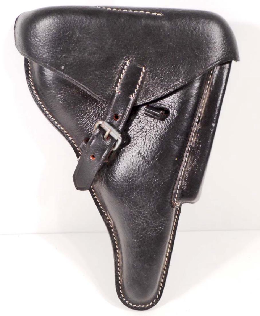 GERMAN NAZI PARABELLUM P-08 LUGER PISTOL LEATHER: Measures 7 7/8" wide by 10 1/4" long. The reverse side is marked with a waffen ampt eagle with 'WaA 655' below. Machine sewn black leather construction.