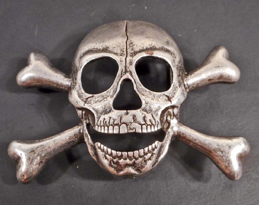 GERMAN NAZI WAFFEN SS SKULL AND CROSS BONES OFFICERS: Measures 4 1/8" wide by 3 1/16" tall. The reverse side is marked with a double set of Waffen SS runics. Nickel construction