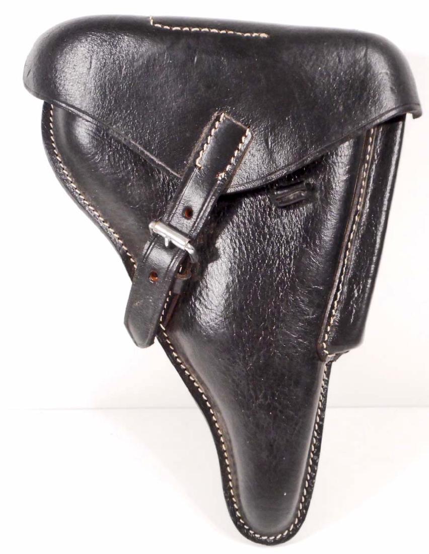 GERMAN NAZI PARABELLUM P-08 LUGER PISTOL LEATHER: Measures 7 7/8" wide by 10 1/4" long. The reverse side is marked with a waffen ampt eagle with 'WaA 655' below. Machine sewn black leather construction.