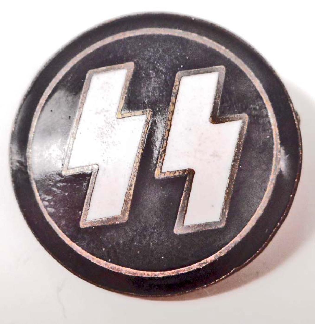 GERMAN NAZI WAFFEN SS PARTY BADGE: Measures 1" in diameter. The reverse side is maker marked 'RZM M1/122'. Has a thin horizontal pin back. Nickel construction with enamel.