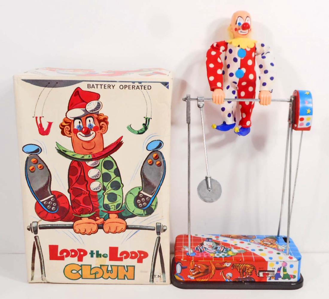 C. 1960'S TIN LITHO LOOP THE LOOP TOY CLOWN IN ORIGINAL: 1960's Tin Litho Battery Operated Loop the Loop Clown Toy in the original box. 11" tall