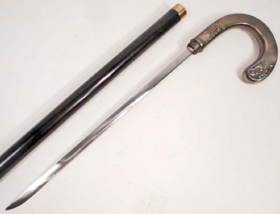 SILVER HOOK CANE SWORD: 38" tall. Hidden sword