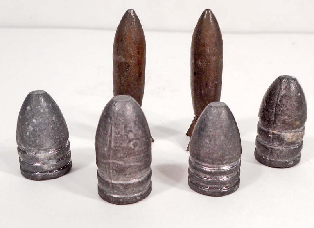 LOT OF 2 VIETNAM ERA LAZY DOG BOMBS & 4 LEAD TIPS: They are not really bombs because they contain no explosive. They are projectiles that cause a lot of destruction.