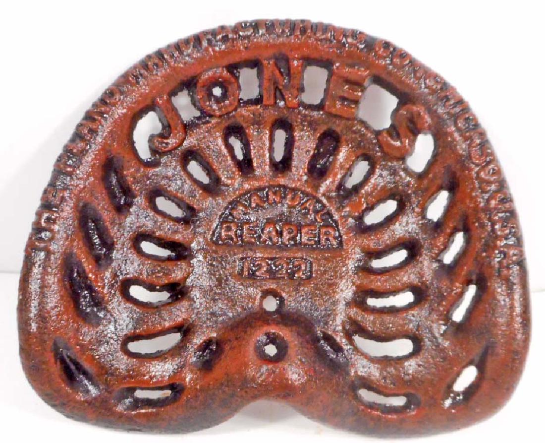 CAST IRON JONES ADVERTISING MINI TRACTOR SEAT: 3" tall