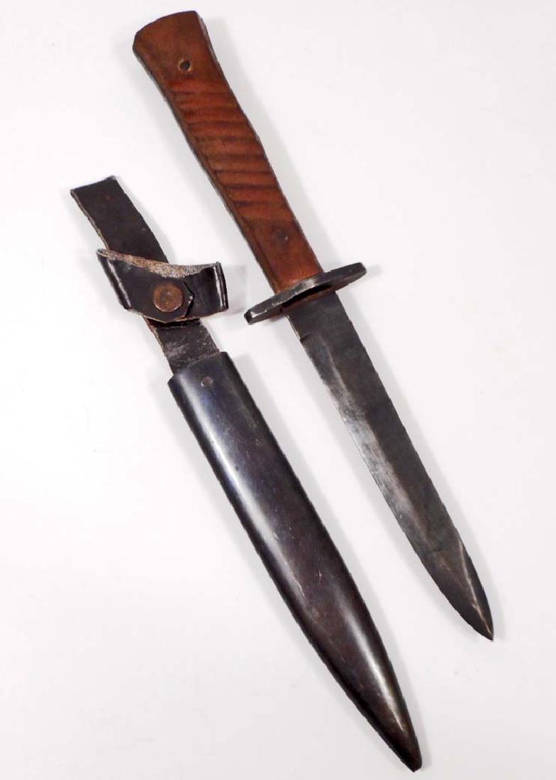 GERMAN ARMY LUFTWAFFE COMBAT BOOT KNIFE AND SCABBARD: Measures 11 7/8" long overall. The steel blade is maker marked 'Gottlieb Hammsfahr Solingen - Foche'. It measures 13/16" wide by 5 5/8" long. Includes the steel scabbard that measures 1" wide by 6 1/2