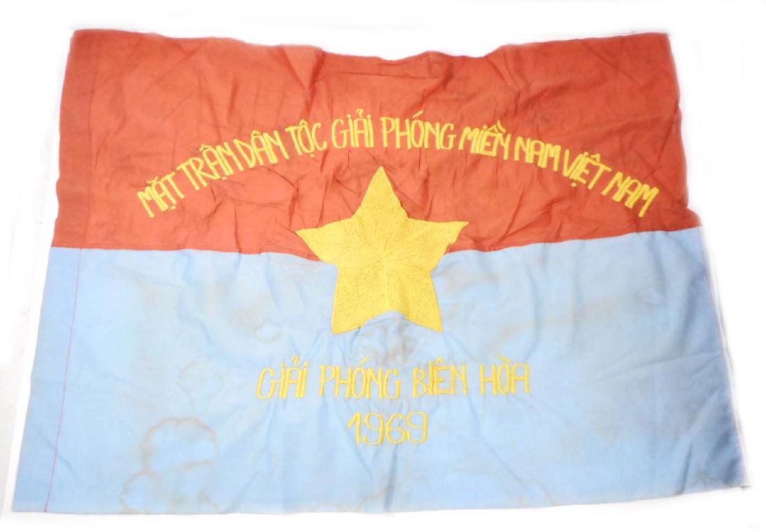 VIET NAM ERA 1969 NORTH VIET CONG VC REGIMENTAL: Measures 28 3/4" wide by 21" tall. The front reads 'Mat Tran Dan Toc Giai Phong Mien Nam Viet Nam Giai Phong Bien Hoa 1969'. Has a yellow star in the center. Two piece machine embroidered and machine 