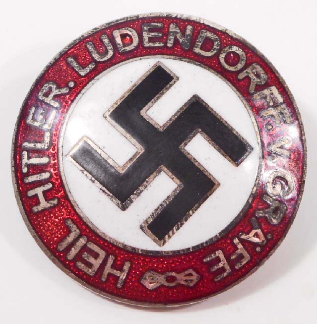 GERMAN NAZI HEIL HITLER LUDENDORFF V GRAFE PARTY BADGE: Measures 15/16" in diameter. The front reads 'Heil Hitler Ludendorff v Grafe'. Has a swastika in the center. The reverse side is maker marked 'RZM M1/73 ges gesch'. Has a thin horizontal safety pin ba