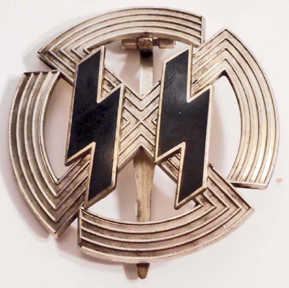 GERMAN NAZI WAFFEN SS SILVER SPORTS PROFICIENCY BADGE: Measures 2" in diameter. The reverse side is maker marked 'Richard Sieper & Sohne Ludenscheid RZM M1/25'. Has a wide vertical pin back. Three piece nickel construction with a pair of black enameled ru