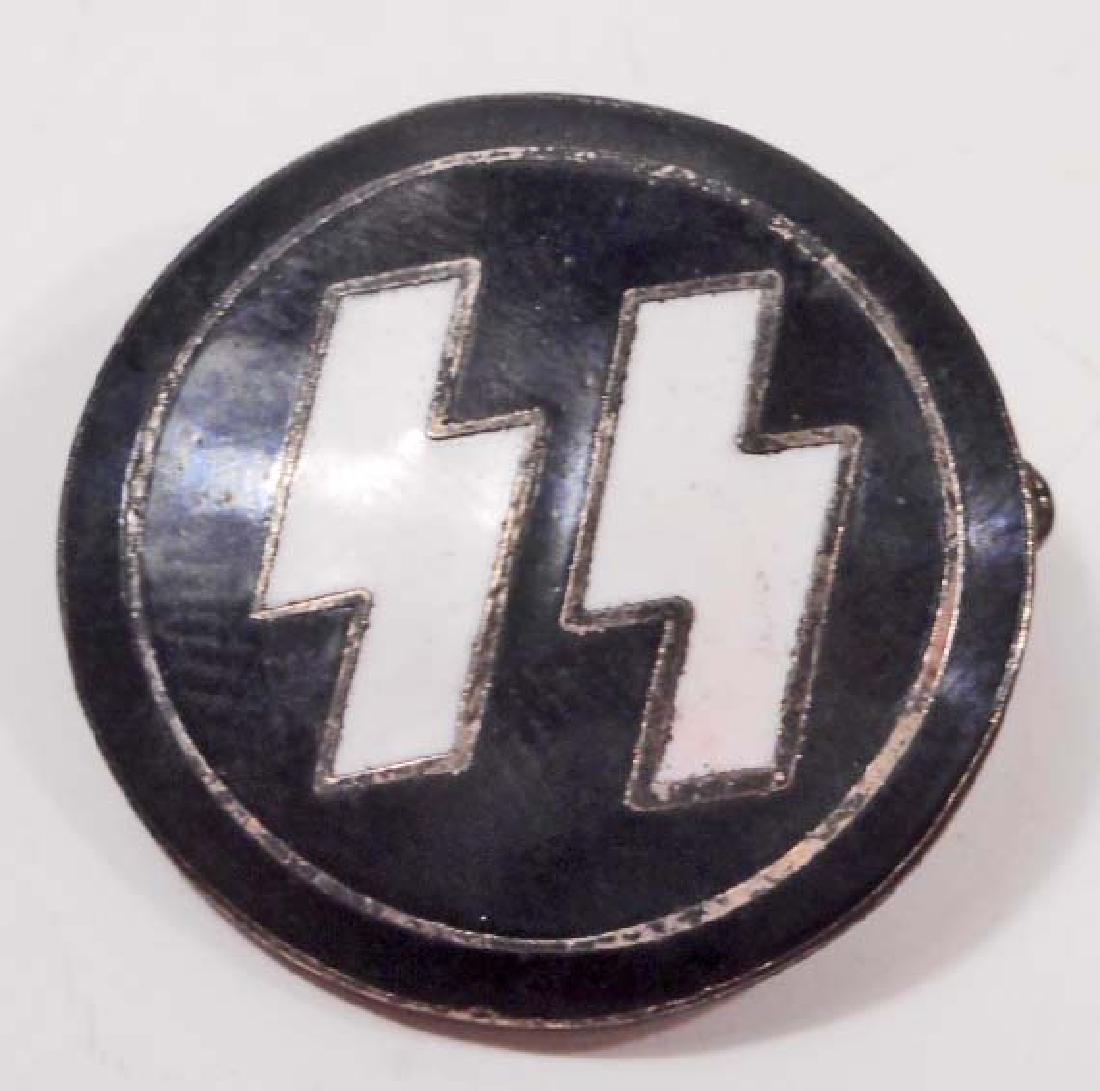 GERMAN NAZI WAFFEN SS RUNIC PARTY PIN: Measures 7/8" in diameter. The front shows a pair of Waffen SS runics. The reverse side is maker marked 'RZM M1/122'. Has a thin horizontal pin back. One piece nickel construction with black and white