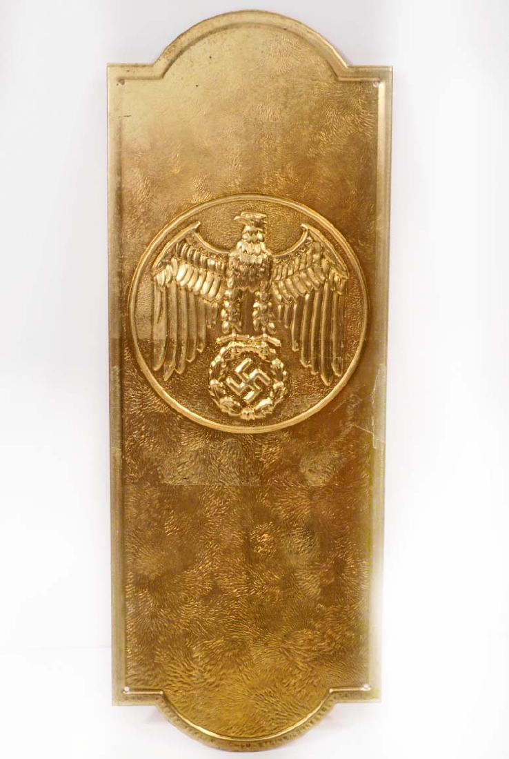 GERMAN NAZI POLITICAL LEADER EAGLE DOOR PLAQUE: Measures 3 3/4" wide by 10 1/16" tall. The front shows a Political German eagle. Stamped brass construction.