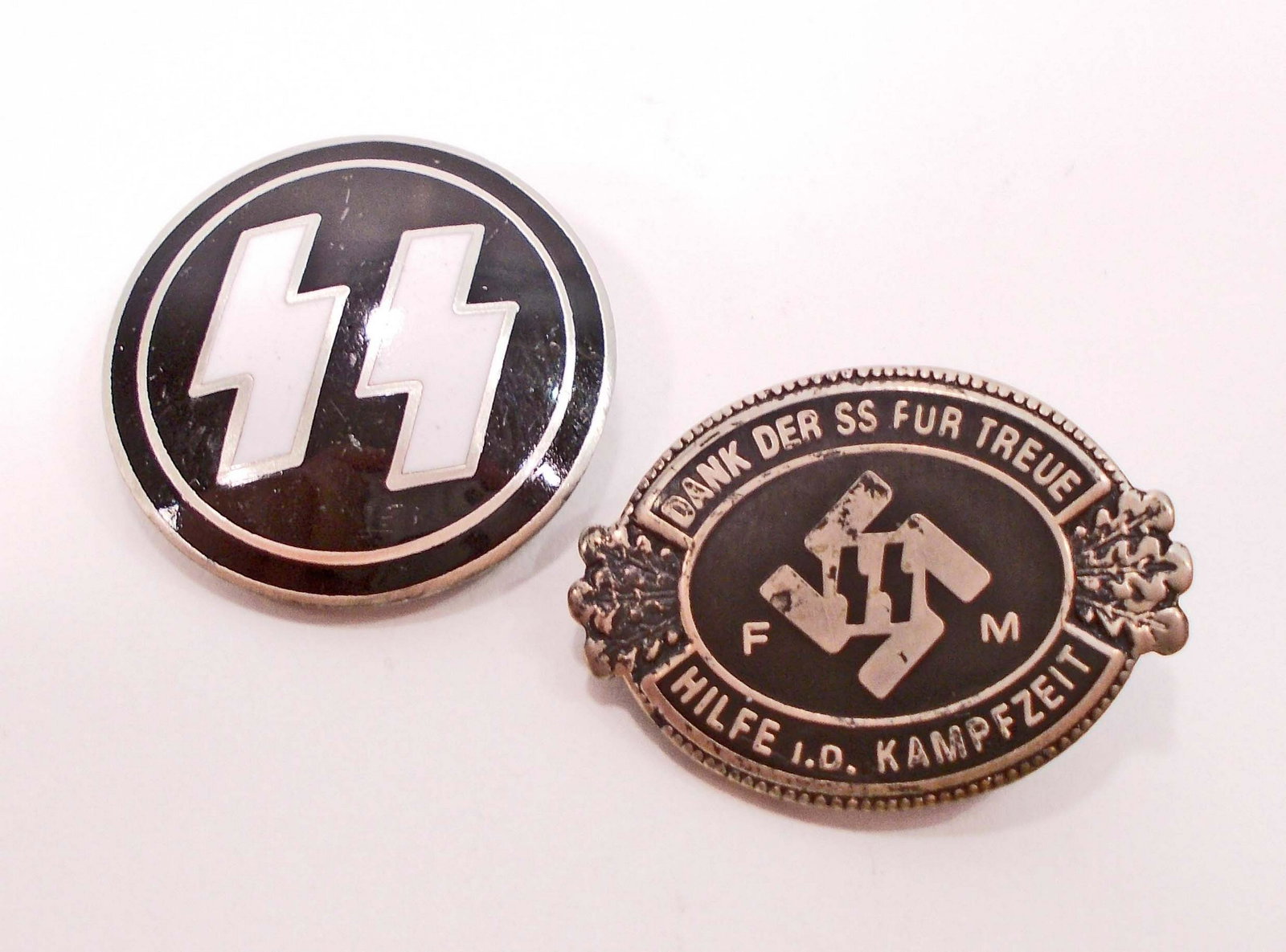 GERMAN NAZI WAFFEN SS FM DONATION MEMBERSHIP BADGE: Reverse side is maker marked RZM M1/133. Also included is a Waffen SS membership badge. Maker marked is RZM M1/4 ges gesch. Both have a thin horizontal pinback. Nickel construction with enamel.