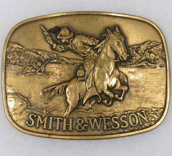 VINTAGE SMITH AND WESSON BRASS BELT BUCKLE: Marked on back 1975 Smith and Wesson.