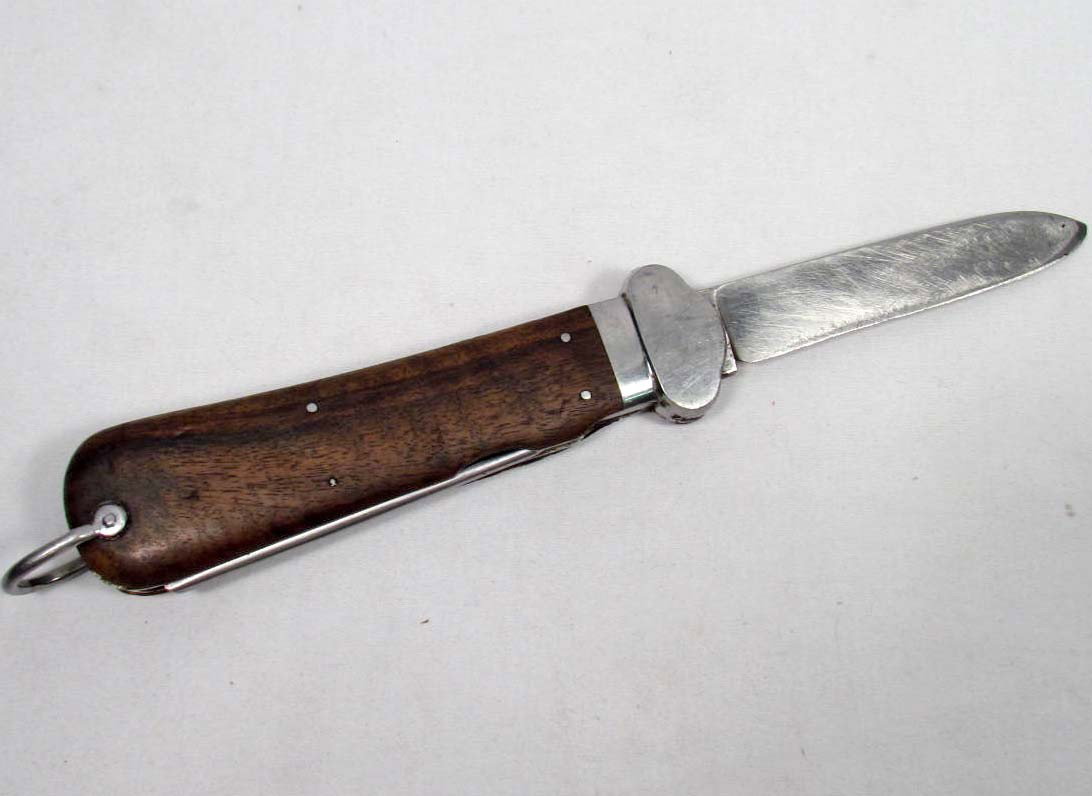RARE GERMAN LUFTWAFFE PARATROOPER FALLSCHIRMJAGER : The blade is maker marked SMF Solingen Rostfrei. It has been sharpened. The locking lever device is not present. It has a Luftwaffe issue stamp on the spike. Measures 10 " long overall.