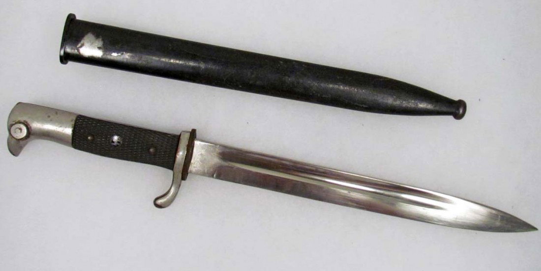 GERMAN NAZI SS DRESS BAYONET W/ SCABBARD: Maker marked Carl Eickhorn Solingen, with the squirrel logo. Measures 16 1/8" long overall.