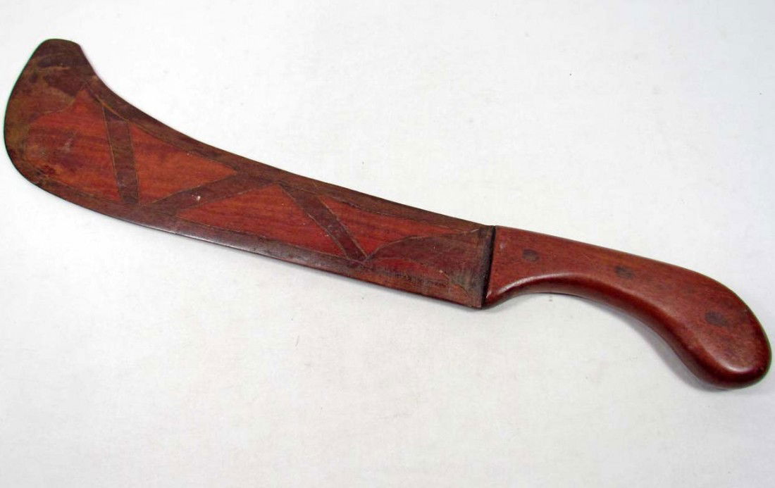 VINTAGE HAND CARVED HAITI WOOD MACHETE: Approx. 19.75" long by 4.25" wide at the blade tip. The wood blade is hand carved w/ the word HAITI in the center.