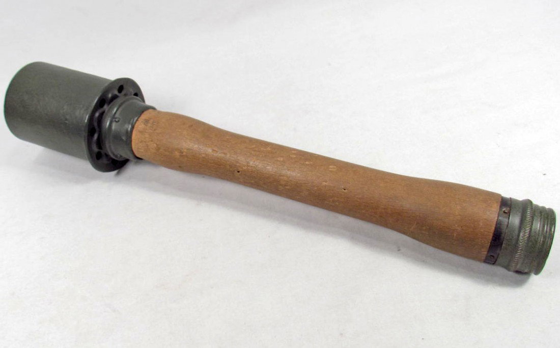 RARE DEWAT GERMAN NAZI POTATO MASHER STICK GRENADE: Approx. 13.75" long overall. The top of the head is maker marked Hagenuk 1939. Includes the porcelain ball in the bottom of the handle. Has a steel head and wood handle.