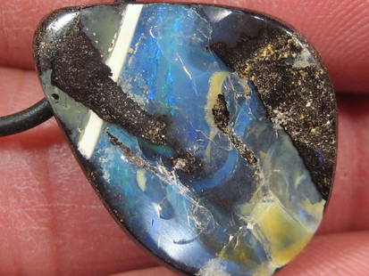 19.70Cts 1.5mm Drilled Boulder Opal.: The Boulder opal is especially attractive because, as it has a dark body tone which adds vibrancy to the play of color. Boulder opal also has a high density because of the ironstone content, and can