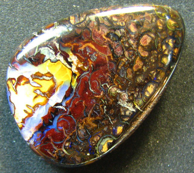 25.60 ct Matrix Opal.: Matrix opal consists of thin seams or spots of precious opal in matrix. The matrix is usually dark ironstone, but occasionally a light sand stone. Also called Mass opal. MWF308