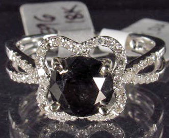 18K WHITE GOLD BLACK AND WHITE DIAMOND RING - SIZE : Comes with GLA Appraisal of $7,909.00. 1 round black diamond center stone. 48 round single cut diamonds. Diamonds - 1.89 cts., TW - 3.00 grams