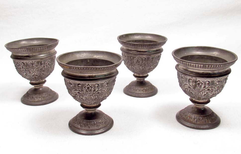 LOT OF 4 PEWTER EGG HOLDERS: They measure 2 1/8" by 2 1/2". They have very finely detailed floral designs.