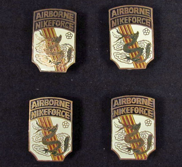 LOT OF 4 US VIET NAM ERA AIRBORNE NIKE FORCE BEER : They have two clutch back on the reverse of each one. Brass construction.