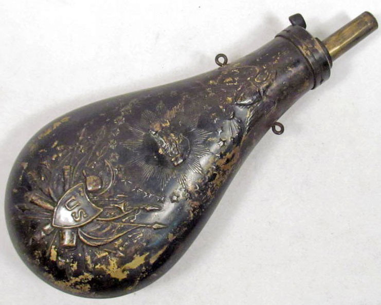 OLD WEST ANTIQUE COWBOY ERA US PEACE GUN POWDER FL: Measures 4 3/4" by 9". Has a military motif of a cannon, flags, spear, axe, eagle, helmet, arrows and a shield. Brass construction.