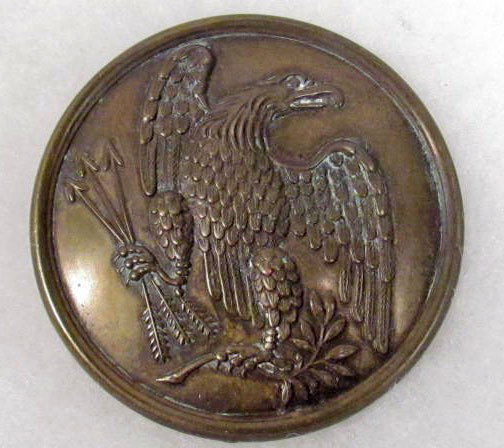 US CIVIL WAR ERA ARMY MARTINGALE EM BELT BUCKLE: Measures 2 1/2" in diameter. Has three prongs for securing to the leather belt. Stamped brass construction with a lead filled back.