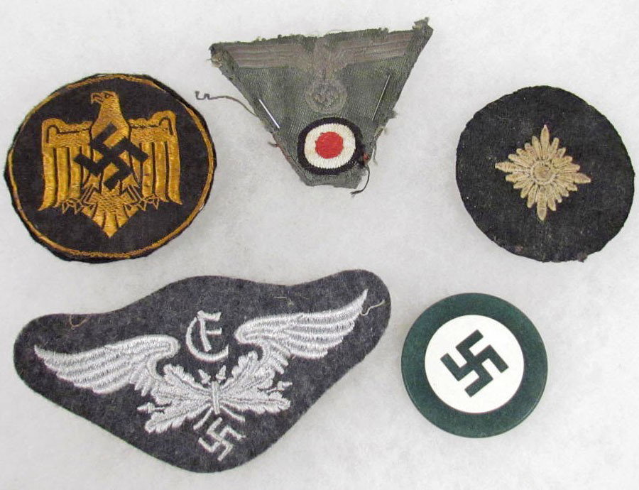LOT OF 4 GERMAN NAZI CLOTH INSIGNIAS: . Includes Luftwaffe, sports, army M-43 EM cap trapezoid, pip, and a Nazi poker chip.