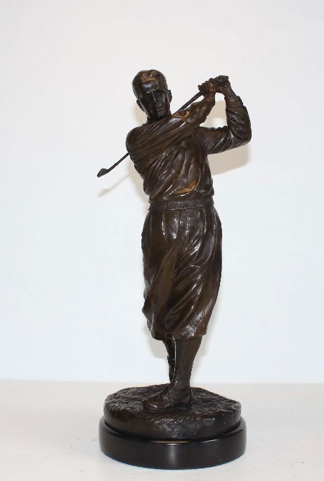 Striking Bobby Jones Golfer, Bronze Sculpture, Aft: CD007 Striking Bobby Jones Golfer, Bronze Sculpture, After Ron Tunison 15.5H x 6.5W x 6.5D 14 lbs. This bronze sculpture was produced using the Lost Wax casting method. The Lost Wax Cast method is the