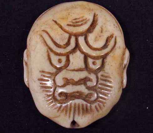 CARVED OX BONE PENDANT