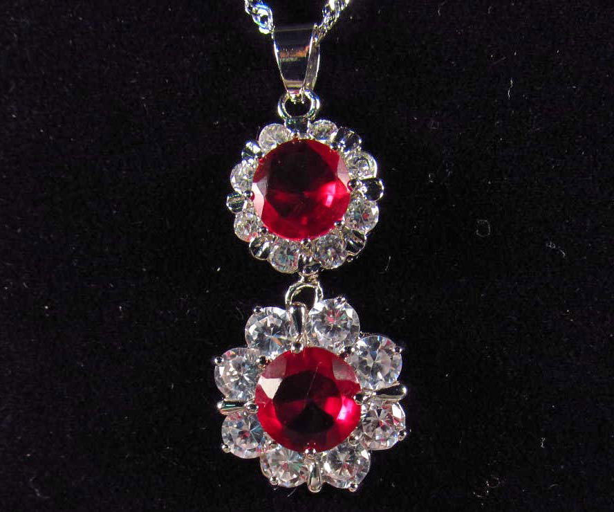 8299 - WHITE GOLD PLATED RUBY & TOPAZ PENDANT W/ C
