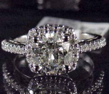 14K WHITE GOLD LADIES DIAMOND RING - SIZE 7: Comes w/ AIG Appraisal of $19,500.00. One prong set round brilliant cut Diamond center stone. 34 prong set single cut Diamonds. Diamonds 1.56 cts, Total Weight 5.30 grams.