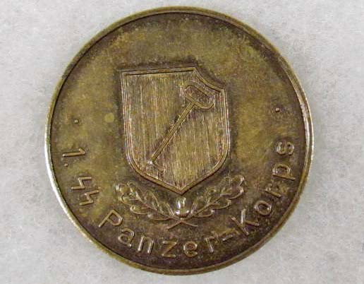 GERMAN NAZI LEIBSTANDARTE SS ADOLF HITLER LAH TABL: approx. 1 5/8" diameter. Reverse side reads 1. SS Panzer Korps. Has their divisional insignia emblem in the center. Brass die struck construction.