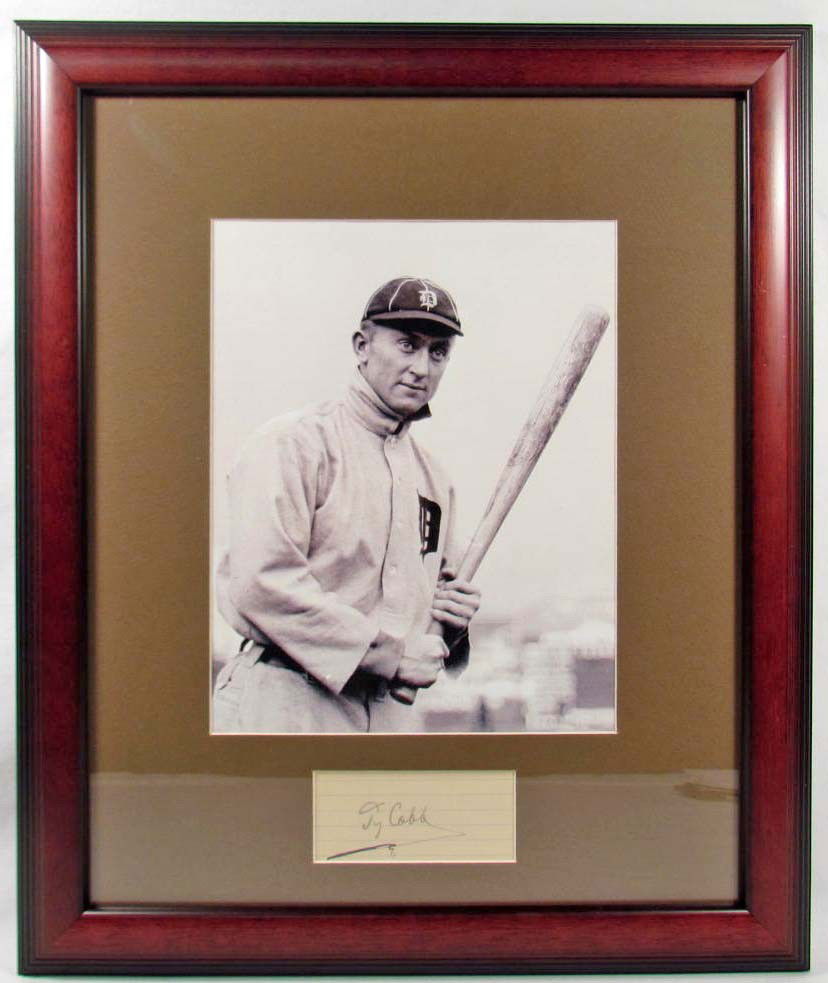CUT SIGNATURE OF TY COBB W/ PHOTO - FRAMED W/ COA: Photo of Ty Cobb w/ cut signature penned in black ink. Matted and framed. Approx. 15" by 18". COA from Ace Autograph Certification.