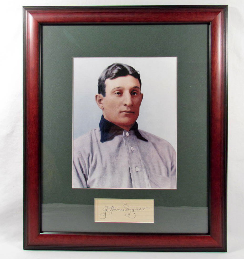HONUS WAGNER CUT SIGNATURE W/ PHOTO - FRAMED W/ CO: Cut Signature of Honus Wagner signed in black ink. Matted and framed. Approx. 15" by 18". COA from Ace Autograph Certification.