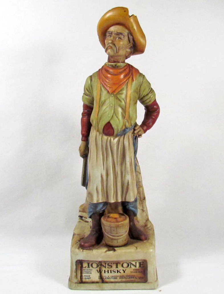 3819 - 1969 LIONSTONE WHISKEY ADVERTISING BOTTLE -: "Original Bitterroot Sculptured Porcelain 1969" Excellent condition.