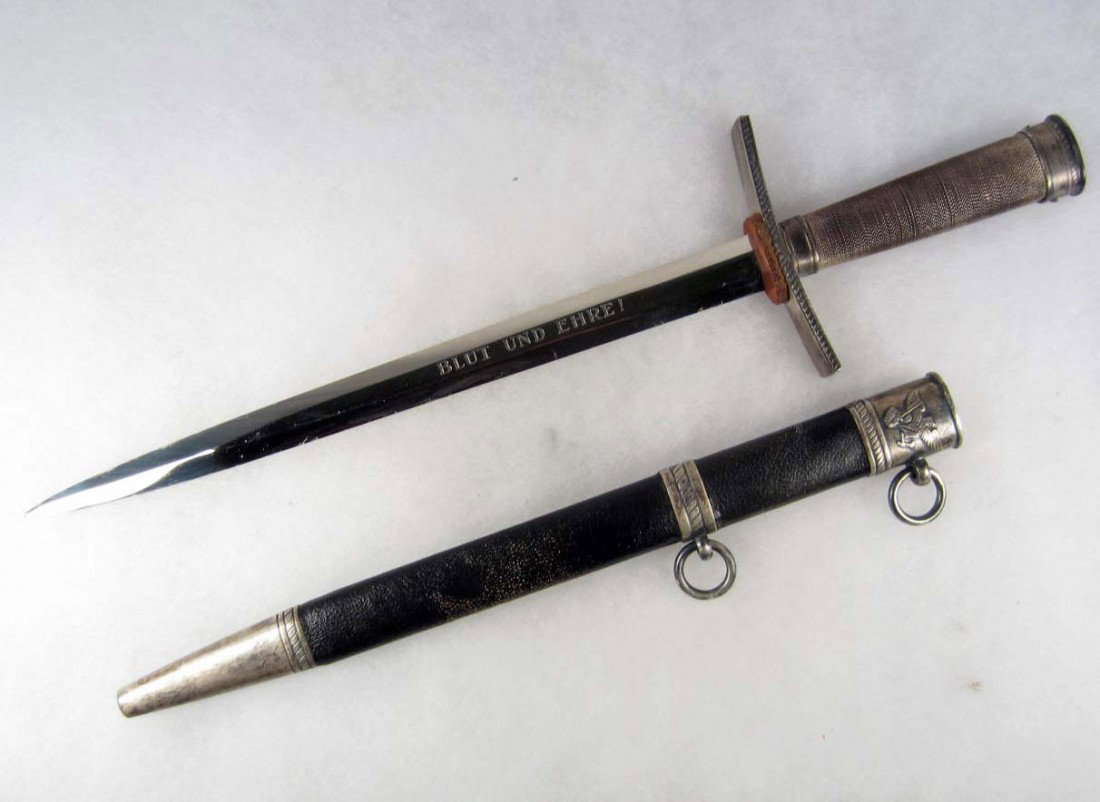 RARE GERMAN NAZI HITLER YOUTH LEADERS OFFICERS DAGG: Approx. 14 3/8" long overall. Maker marked RZM M7/36 (E F Horster Solingen). The etched blade reads Blut Und Ehre! (Blood and Honor). Has a blue leather covered scabbard w/ nickel silver fittings.