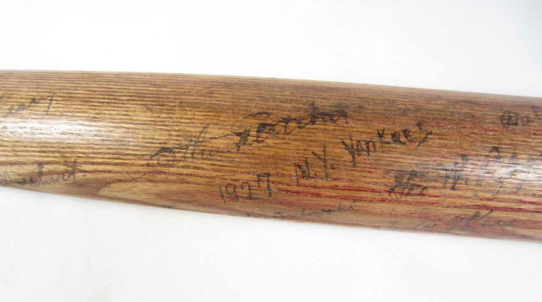 1927 NEW YORK YANKEES TEAM SIGNED BASEBALL BAT: Includes signatures from Babe Ruth, Lou Gehrig, Pt Collins, Eddie Phillips, Earle Combs, Joe Dugan, Dutch Ruether, Waite Hoyt, Tony Lazzeri, Jacob Ruppert, John Grabowski, Urban Shocker, Herb Pennock