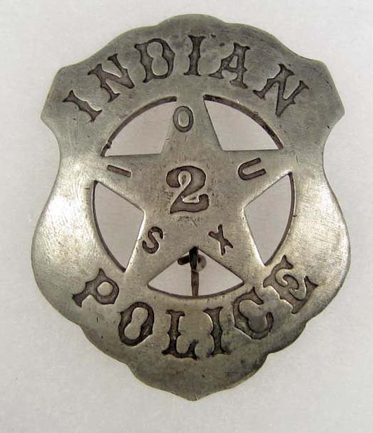 OLD WEST SIOUX INDIAN POLICE NO. 2 COWBOY ERA LAW BA: Approx. 2 1/16" by 2 9/16". Pinback. This is a shield shaped badge w/ a cut out star in the center. Nickel construction.