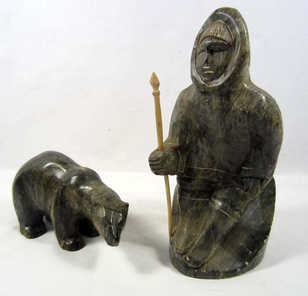 CARVED SOAPSTONE ESKIMO MAN W/ POLAR BEAR: Man is approx. 8" tall and the bear is approx. 6" long