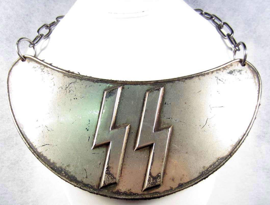 RARE GERMAN NAZI WAFFEN SS GORGET W/ NECK CHAIN: Approx. 3 3/4" by 8 1.4". Has a pair of large lightning bolt runics in the center. The gorget and chain are both nickel.