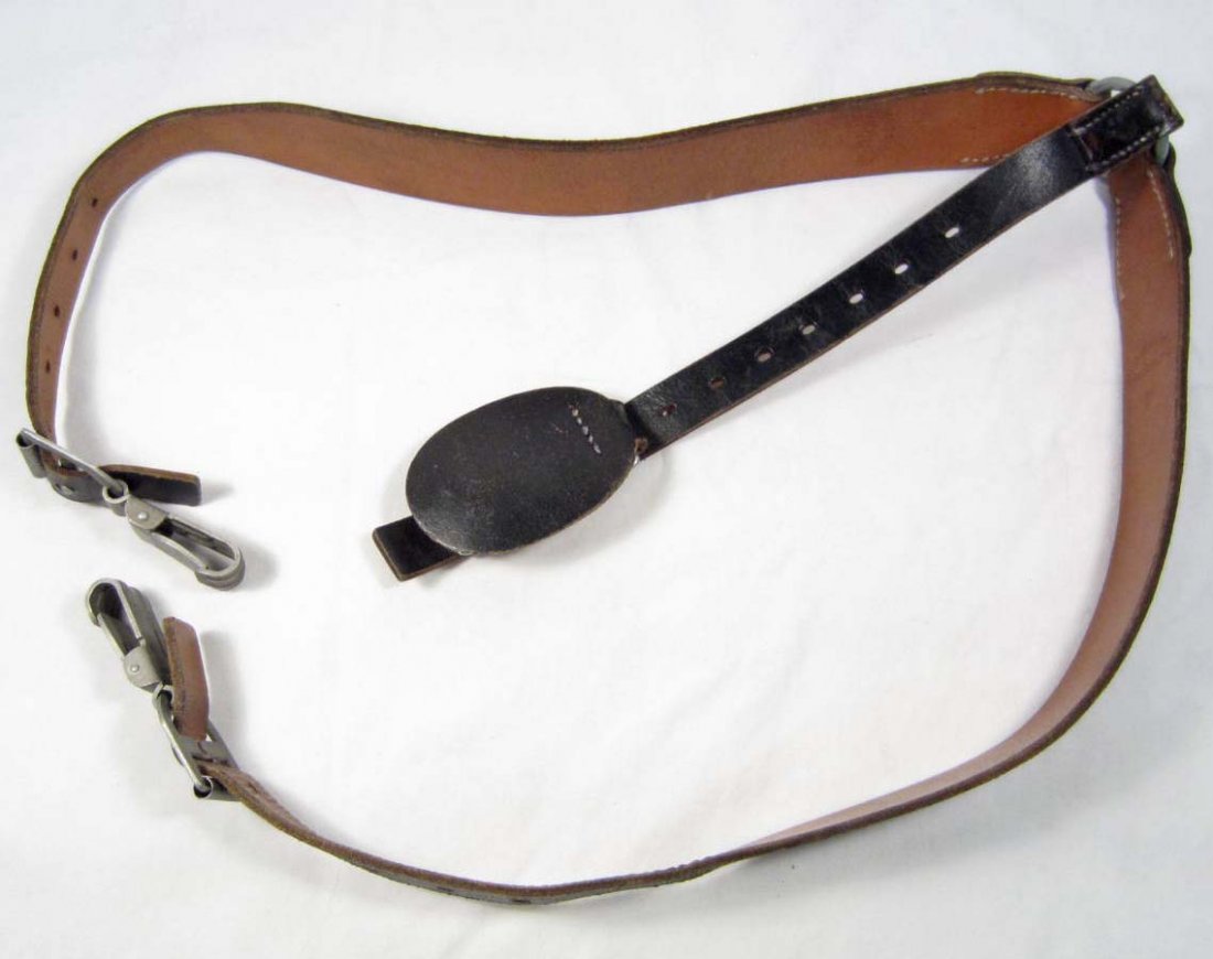 SET OF GERMAN NAZI ARMY LEATHER COMBAT Y STRAPS: Approx. 37.5" long overall. Maker marked franz Brehme w/ an army waffen ampt eagle below. Brown and black leather construction.