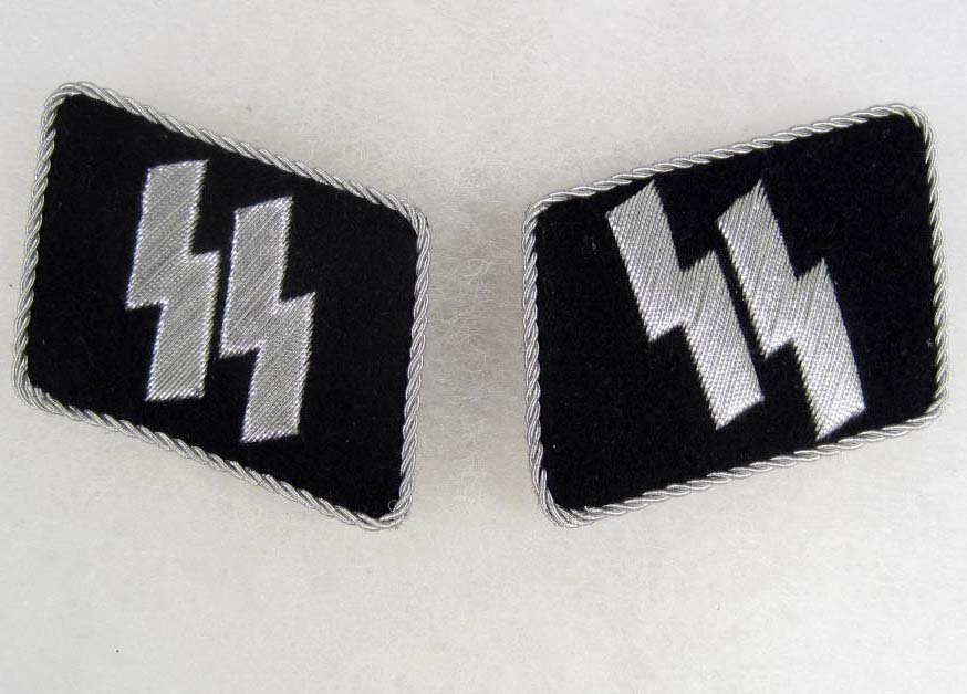 PAIR OF GERMAN NAZI WAFFEN SS CONCENTRATION CAMP O: has a pair of lightening bolt runics on each tab. Silver bullion wire construction embroidered on a black wool backing. Both have twisted silver bullion wire piping around the edge of each collar tab.