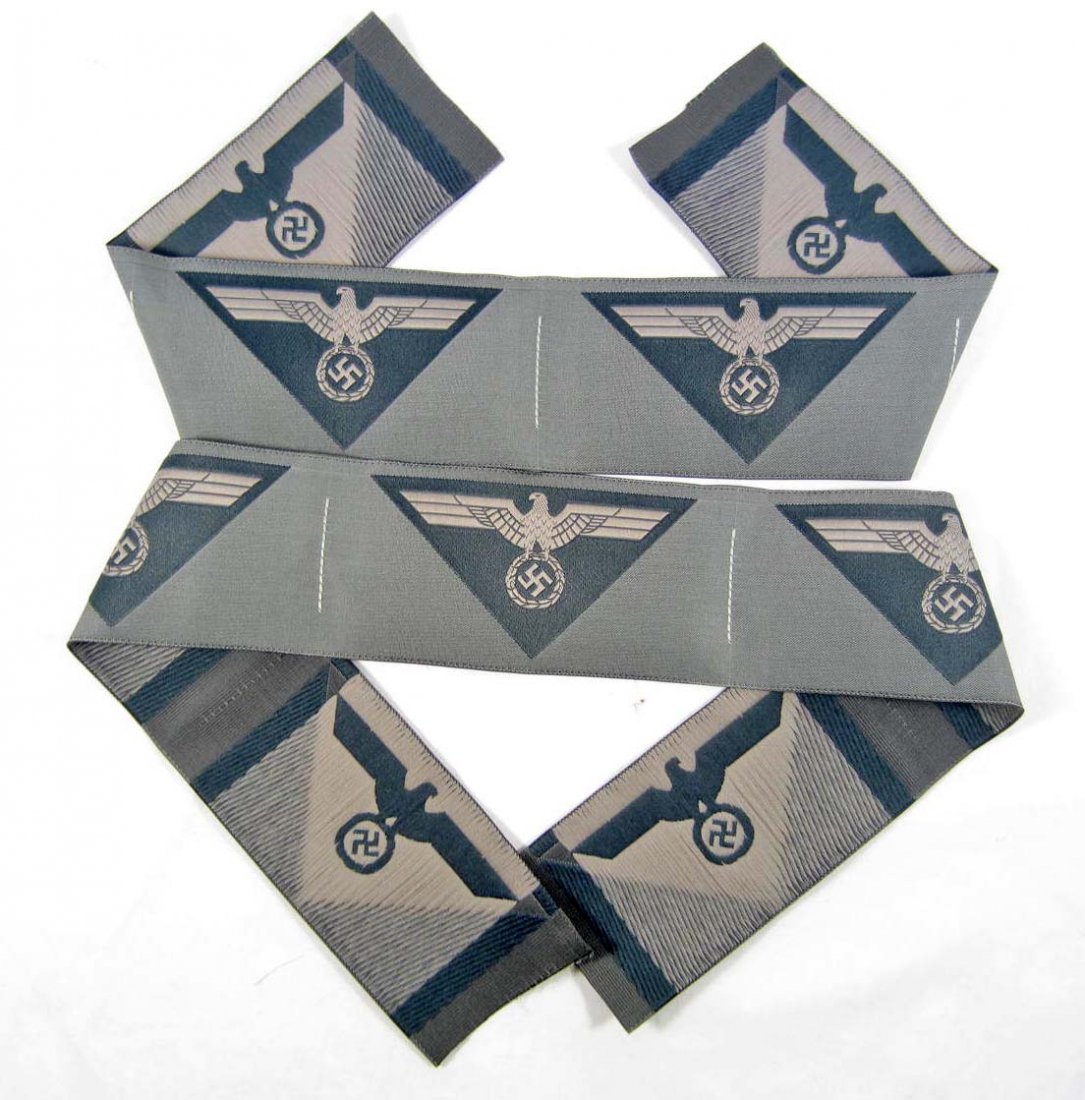 LOT OF 9 GERMAN NAZI ARMY M-1944 TUNIC EM BREAST E: Cut from a roll. Unissued. Cloth bevo construction. For an enlisted man.