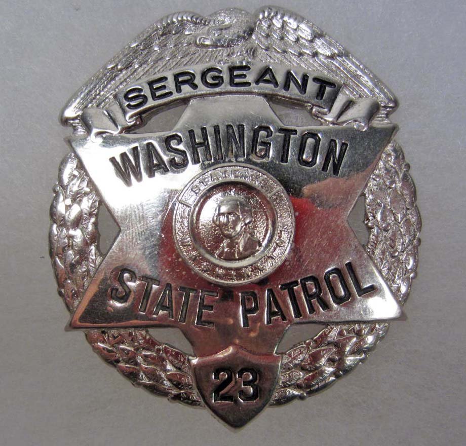 OBSOLETE WASHINGTON STATE PATROL SERGEANT #23 POLIC: Approx. 2 1/4" by 2 11/16". Pinback. Nickel construction. This is an eagle top badge w/ a cut out star below.