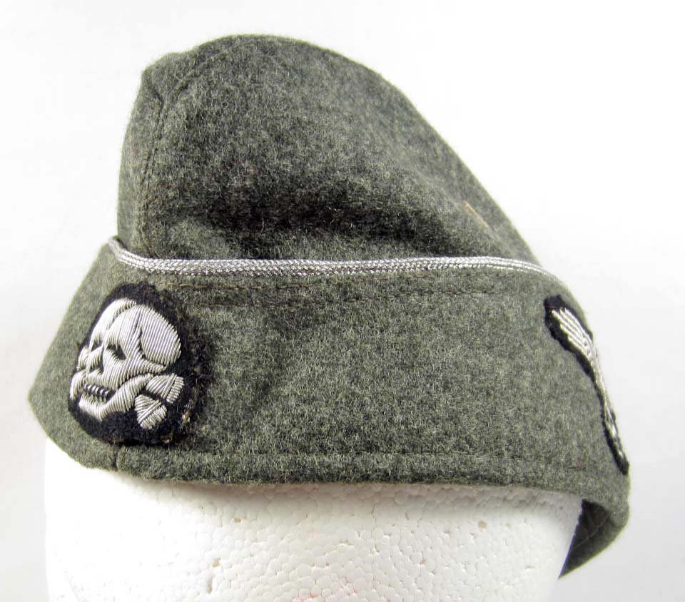 RARE GERMAN NAZI WAFFEN SS OFFICERS OVERSEAS CAP: Inside is maker marked Robert Lubstein Berlin NO 55 1940 58. Has a silver bullion wire skull on the front w/ an embroidered sS eagle on the side. Has silver bullion wire piping The body is green wool 